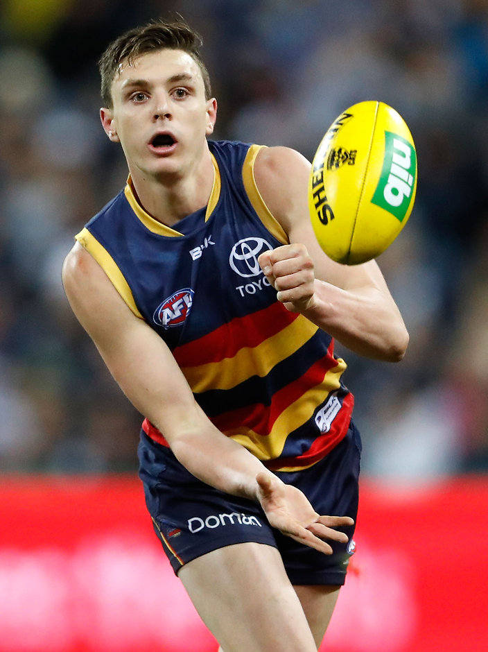 AFL 2016 Rd 18 - Geelong v Adelaide GEELONG, AUSTRALIA - JULY 23: Jake Lever of the Crows handpasses the ball during the 2016 AFL Round 18 match between the Geelong Cats and the Adelaide Crows at Simonds Stadium on July 23, 2016 in Geelong, Australia. (Photo by Adam Trafford/AFL Media)